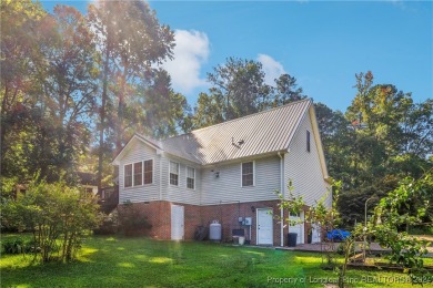 Nestled in the sought-after gated community of Carolina Trace on Carolina Trace Country Club in North Carolina - for sale on GolfHomes.com, golf home, golf lot