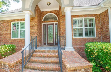 Welcome to your dream home! Nestled in the picturesque community on Ocean Ridge Plantation in North Carolina - for sale on GolfHomes.com, golf home, golf lot