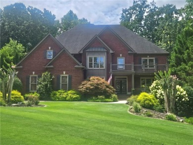 This exquisite estate in Suwanee is truly a remarkable find! on Laurel Springs Golf Club in Georgia - for sale on GolfHomes.com, golf home, golf lot