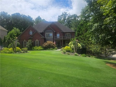This exquisite estate in Suwanee is truly a remarkable find! on Laurel Springs Golf Club in Georgia - for sale on GolfHomes.com, golf home, golf lot