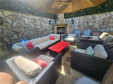 This exquisite estate in Suwanee is truly a remarkable find! on Laurel Springs Golf Club in Georgia - for sale on GolfHomes.com, golf home, golf lot