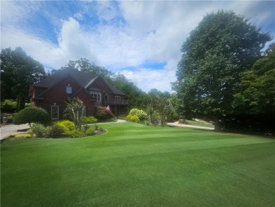 This exquisite estate in Suwanee is truly a remarkable find! on Laurel Springs Golf Club in Georgia - for sale on GolfHomes.com, golf home, golf lot