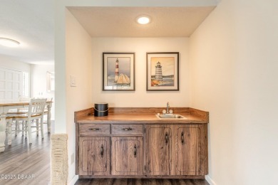 Discover this beautifully maintained 3-bed, 2-bath canal front on The Club At Pelican Bay - North Course in Florida - for sale on GolfHomes.com, golf home, golf lot