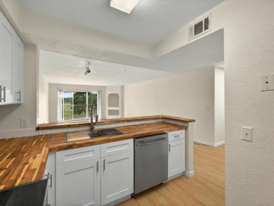 This stunning two-bedroom two-bathroom, third-floor, corner unit on Hunters Creek Golf Course in Florida - for sale on GolfHomes.com, golf home, golf lot