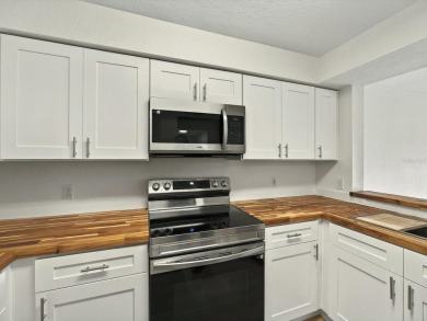 This stunning two-bedroom two-bathroom, third-floor, corner unit on Hunters Creek Golf Course in Florida - for sale on GolfHomes.com, golf home, golf lot