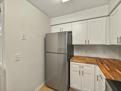 This stunning two-bedroom two-bathroom, third-floor, corner unit on Hunters Creek Golf Course in Florida - for sale on GolfHomes.com, golf home, golf lot