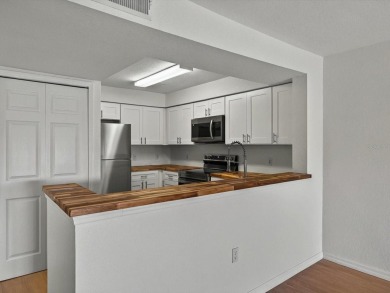 This stunning two-bedroom two-bathroom, third-floor, corner unit on Hunters Creek Golf Course in Florida - for sale on GolfHomes.com, golf home, golf lot