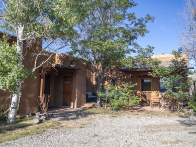 Discover unparalleled beauty and comfort in this exquisite on Taos Country Club in New Mexico - for sale on GolfHomes.com, golf home, golf lot