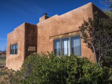 Discover unparalleled beauty and comfort in this exquisite on Taos Country Club in New Mexico - for sale on GolfHomes.com, golf home, golf lot