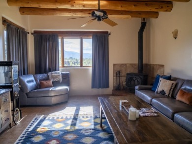 Discover unparalleled beauty and comfort in this exquisite on Taos Country Club in New Mexico - for sale on GolfHomes.com, golf home, golf lot