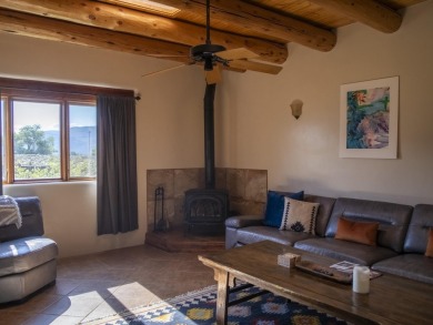 Discover unparalleled beauty and comfort in this exquisite on Taos Country Club in New Mexico - for sale on GolfHomes.com, golf home, golf lot
