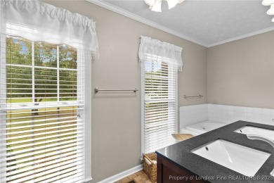 Welcome to this beautifully maintained brick ranch-style home on Baywood Golf Club in North Carolina - for sale on GolfHomes.com, golf home, golf lot