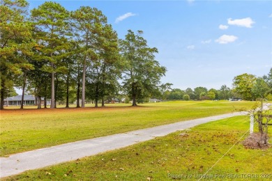 Welcome to this beautifully maintained brick ranch-style home on Baywood Golf Club in North Carolina - for sale on GolfHomes.com, golf home, golf lot