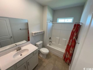 This beautiful 4-bedroom, 2-bathroom home is located in the on Surf Golf and Beach Club in South Carolina - for sale on GolfHomes.com, golf home, golf lot