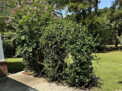 This two-bedroom three bath home is tucked away on a quiet on Wedgefield Plantation Golf Club in South Carolina - for sale on GolfHomes.com, golf home, golf lot