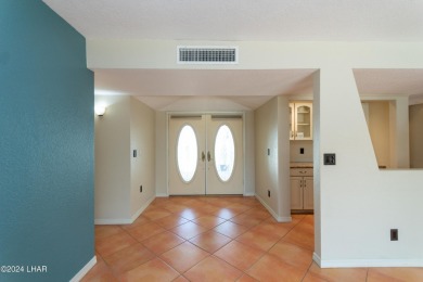 Take a Walk thru this Double Door Skylight Entrance into a on London Bridge Golf Course in Arizona - for sale on GolfHomes.com, golf home, golf lot