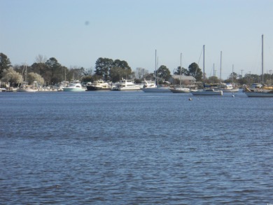 This two-bedroom three bath home is tucked away on a quiet on Wedgefield Plantation Golf Club in South Carolina - for sale on GolfHomes.com, golf home, golf lot