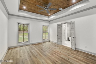 Welcome to this beautiful 4 bedroom, 2.5 bath home located in on Lake Caroline Golf Club in Mississippi - for sale on GolfHomes.com, golf home, golf lot
