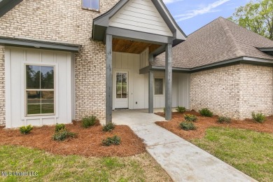 Welcome to this beautiful 4 bedroom, 2.5 bath home located in on Lake Caroline Golf Club in Mississippi - for sale on GolfHomes.com, golf home, golf lot