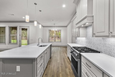 Welcome to this beautiful 4 bedroom, 2.5 bath home located in on Lake Caroline Golf Club in Mississippi - for sale on GolfHomes.com, golf home, golf lot