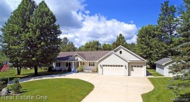 Step inside and discover a thoughtfully designed split ranch on Lost Lake Woods Club in Michigan - for sale on GolfHomes.com, golf home, golf lot