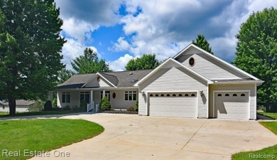 Step inside and discover a thoughtfully designed split ranch on Lost Lake Woods Club in Michigan - for sale on GolfHomes.com, golf home, golf lot