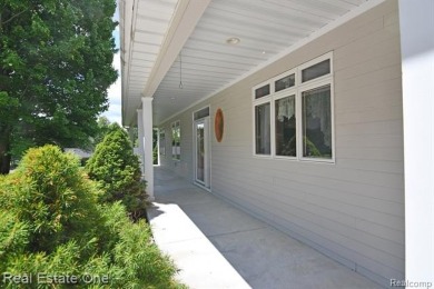Step inside and discover a thoughtfully designed split ranch on Lost Lake Woods Club in Michigan - for sale on GolfHomes.com, golf home, golf lot