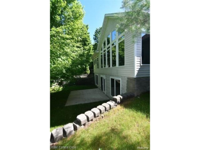 Step inside and discover a thoughtfully designed split ranch on Lost Lake Woods Club in Michigan - for sale on GolfHomes.com, golf home, golf lot