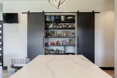 Welcome to 19 Aster Court--where modern design meets effortless on Eagle Ranch in Colorado - for sale on GolfHomes.com, golf home, golf lot