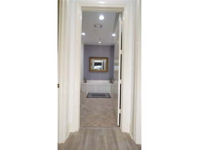 Absolutely stunning 3 bedroom 3 bath coach home overlooking the on The Rookery At Marco in Florida - for sale on GolfHomes.com, golf home, golf lot