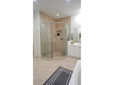 Absolutely stunning 3 bedroom 3 bath coach home overlooking the on The Rookery At Marco in Florida - for sale on GolfHomes.com, golf home, golf lot
