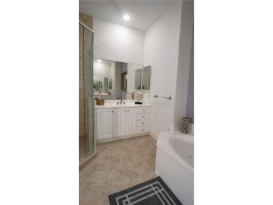 Absolutely stunning 3 bedroom 3 bath coach home overlooking the on The Rookery At Marco in Florida - for sale on GolfHomes.com, golf home, golf lot