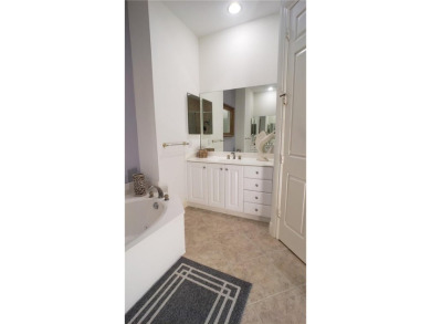 Absolutely stunning 3 bedroom 3 bath coach home overlooking the on The Rookery At Marco in Florida - for sale on GolfHomes.com, golf home, golf lot