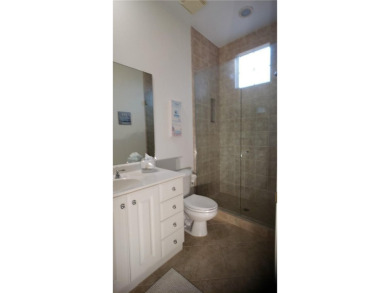 Absolutely stunning 3 bedroom 3 bath coach home overlooking the on The Rookery At Marco in Florida - for sale on GolfHomes.com, golf home, golf lot