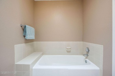 Spacious and bright 2-bed, 2-bath Southwestern-style home just on Sonoma Ranch Golf Course in New Mexico - for sale on GolfHomes.com, golf home, golf lot