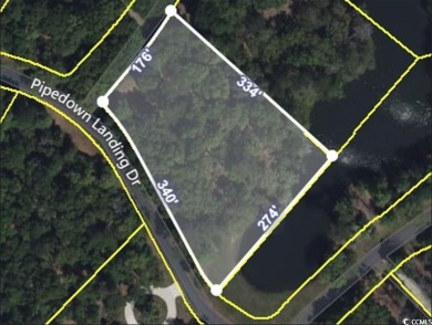 This exceptional private, wooded corner lot offers a on Willbrook Plantation in South Carolina - for sale on GolfHomes.com, golf home, golf lot