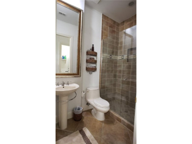 Absolutely stunning 3 bedroom 3 bath coach home overlooking the on The Rookery At Marco in Florida - for sale on GolfHomes.com, golf home, golf lot