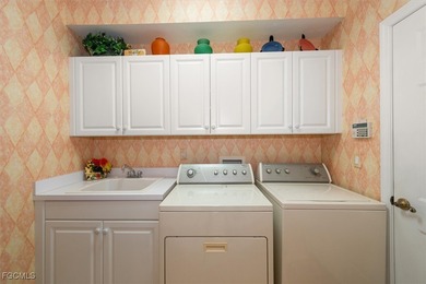 A true location - location - location former model home a short on Pelican Preserve Golf Club in Florida - for sale on GolfHomes.com, golf home, golf lot