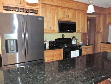 Nestled on a quiet, tree-lined street within walking distance on Spring Green Golf Course in Wisconsin - for sale on GolfHomes.com, golf home, golf lot