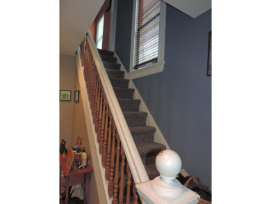Nestled on a quiet, tree-lined street within walking distance on Spring Green Golf Course in Wisconsin - for sale on GolfHomes.com, golf home, golf lot