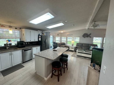 Lot Rent $1342.00 monthly  Beautiful stucco home located on a on Del Tura Golf and Country Club in Florida - for sale on GolfHomes.com, golf home, golf lot