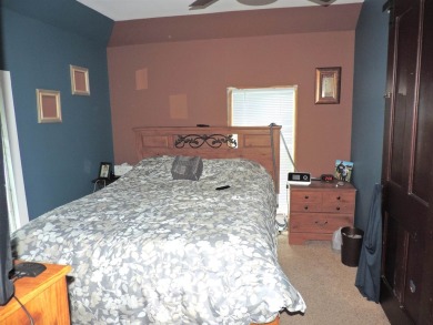 Nestled on a quiet, tree-lined street within walking distance on Spring Green Golf Course in Wisconsin - for sale on GolfHomes.com, golf home, golf lot