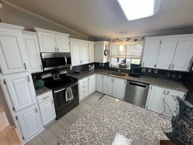 Lot Rent $1342.00 monthly  Beautiful stucco home located on a on Del Tura Golf and Country Club in Florida - for sale on GolfHomes.com, golf home, golf lot