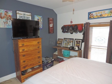 Nestled on a quiet, tree-lined street within walking distance on Spring Green Golf Course in Wisconsin - for sale on GolfHomes.com, golf home, golf lot