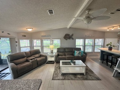 Lot Rent $1342.00 monthly  Beautiful stucco home located on a on Del Tura Golf and Country Club in Florida - for sale on GolfHomes.com, golf home, golf lot