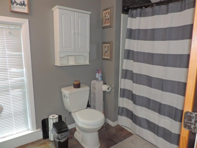 Nestled on a quiet, tree-lined street within walking distance on Spring Green Golf Course in Wisconsin - for sale on GolfHomes.com, golf home, golf lot