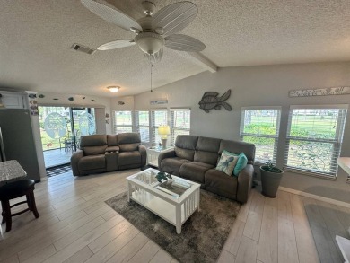 Lot Rent $1342.00 monthly  Beautiful stucco home located on a on Del Tura Golf and Country Club in Florida - for sale on GolfHomes.com, golf home, golf lot