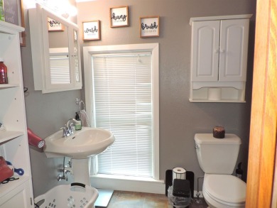 Nestled on a quiet, tree-lined street within walking distance on Spring Green Golf Course in Wisconsin - for sale on GolfHomes.com, golf home, golf lot
