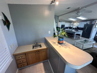 Lot Rent $1342.00 monthly  Beautiful stucco home located on a on Del Tura Golf and Country Club in Florida - for sale on GolfHomes.com, golf home, golf lot