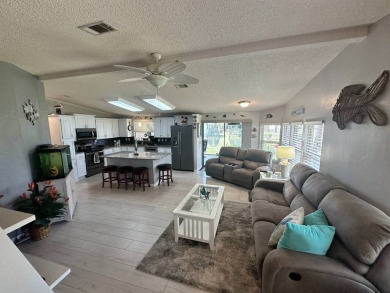 Lot Rent $1342.00 monthly  Beautiful stucco home located on a on Del Tura Golf and Country Club in Florida - for sale on GolfHomes.com, golf home, golf lot